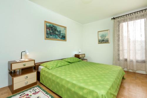 Postel nebo postele na pokoji v ubytování Sisplac Apartment