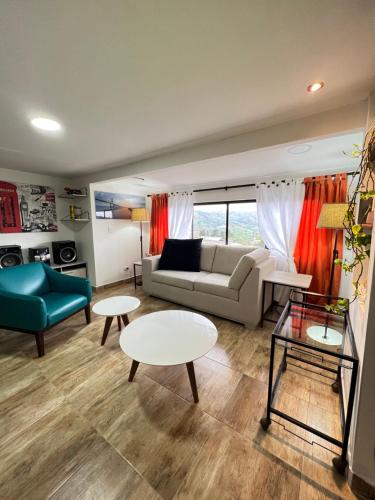 a living room with a couch and a table at Acogedor apto en Sonsón in Sonsón