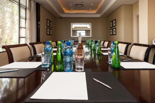 a conference room with a long table with bottles on it at Suncoast Hotel & Towers in Durban