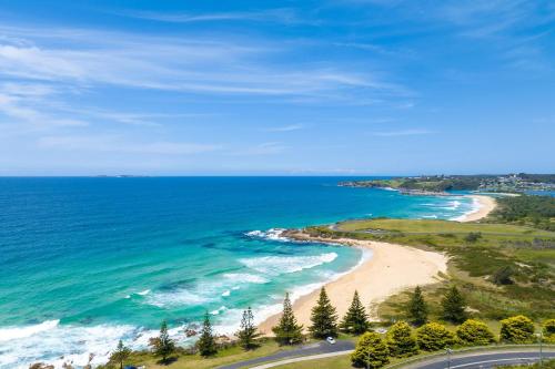 an aerial view of a beach and the ocean at 11 Warbler Crescent in Kianga