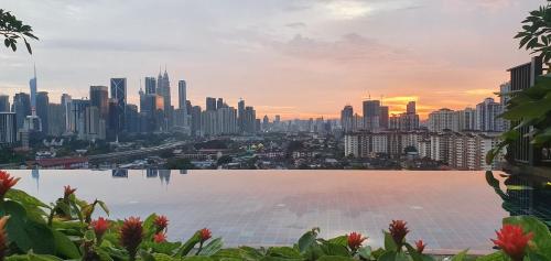 a view of a city skyline with a large body of water at Studio near KLCC and LRT with superb view in Kuala Lumpur