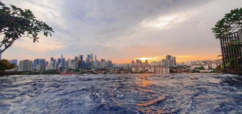 a view of a city skyline from a hot tub at Studio near KLCC and LRT with superb view in Kuala Lumpur