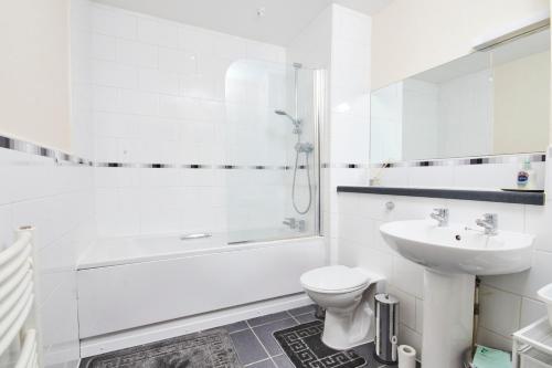 a white bathroom with a toilet and a sink at Free Parking-Central-Contractors-Leisure in Coventry