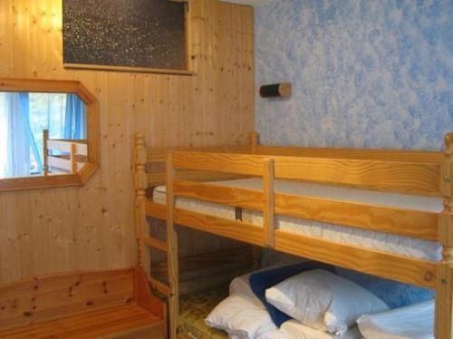 a bedroom with two bunk beds in a cabin at Haus Rhoneblick in Leukerbad