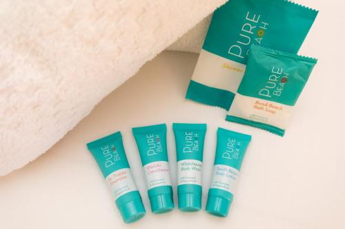 a group of three sunscreen products on a table at Contour Hotel Katherine in Katherine
