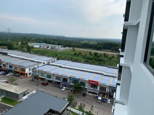 an overhead view of a building with blue roofs at Desaru Utama Apartment with Swimming Pool View, Karaoke, FREE WIFI, Netflix, near to Car Park in Desaru