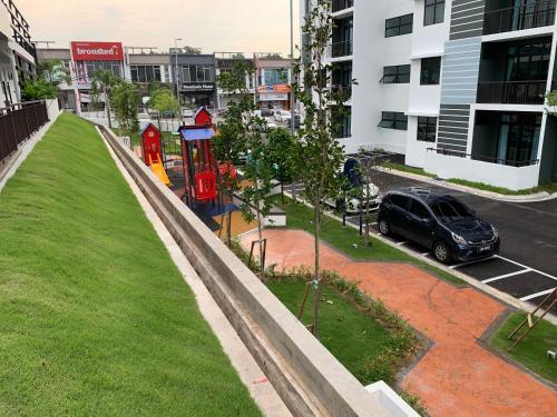 a car parked in a parking lot with red phone booths at Desaru Utama Apartment with Swimming Pool View, Karaoke, FREE WIFI, Netflix, near to Car Park in Desaru