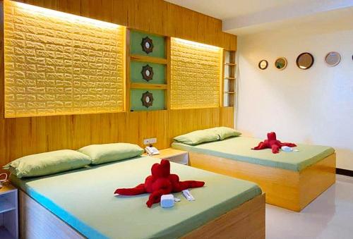 En eller flere senger på et rom på Hakysia Hotel
