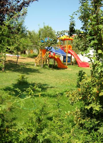 a park with a playground in the grass at Agriturismo Le Vigne in Fermo