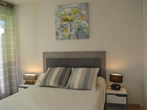 A bed or beds in a room at Appartement Capbreton, 2 pièces, 4 personnes - FR-1-239-872