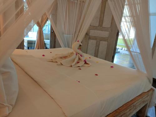 Postel nebo postele na pokoji v ubytování Villa Manis