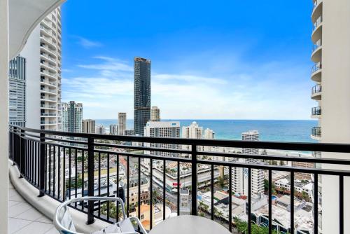 a balcony with a view of the ocean and buildings at 2 Bedroom Beach View Apartment in Surfers Paradise! Free Parking & Wifi in Gold Coast