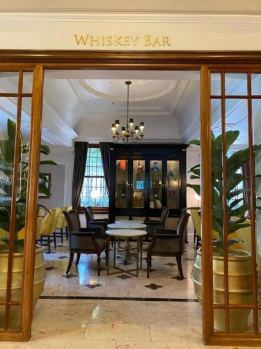 a dining room with a dining table and chairs at Taj Hotel Cape Town - Taj Residence suites in Cape Town