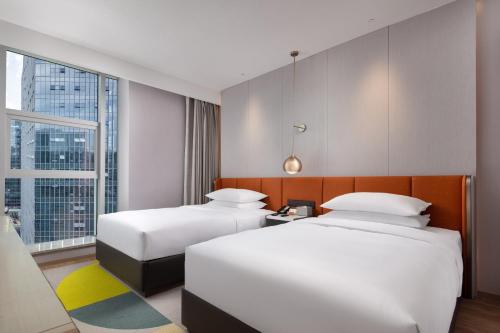 Home2 Suites by Hilton Chongqing Yubeiにあるベッド