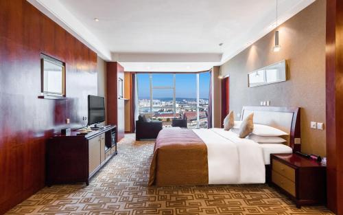 Empark Grand Hotel Kunmingにあるベッド