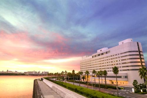 a large building next to a body of water at Tokyo Bay Maihama Hotel First Resort in Urayasu