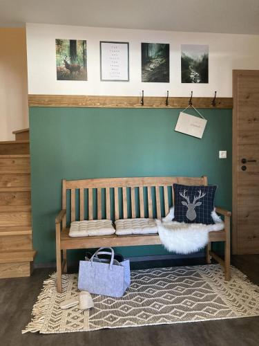 a wooden bench in a room with a wall at Ferienwohnung Einklang in Krün
