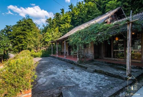 a house in the middle of a forest at Sa Moc - La Maison House & Bungalow in Sa Pa