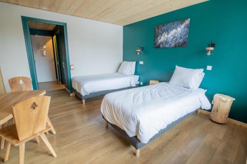 Cama o camas de una habitación en Hotel Les Lutins