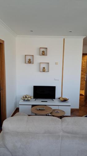 a living room with a couch and a table at Loft Turístico in Vigo