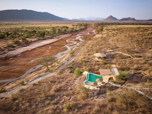an aerial view of a river in a field at Surana Buffalo Springs in Buffalo Springs  National Reserve