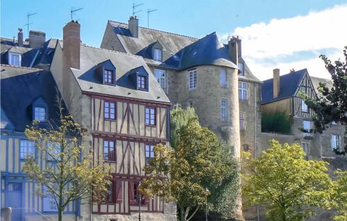a large castle with trees in front of it at Nice Home In Conflans Sur Anille in Conflans-sur-Anille