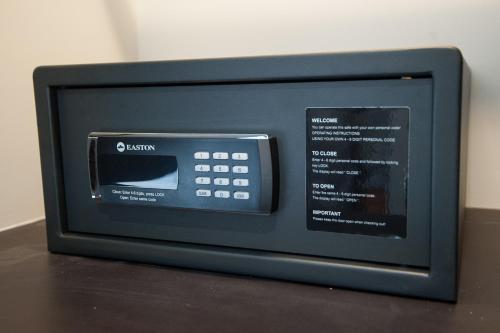 a small microwave oven sitting on top of a table at GLOW PARK HOTEL Grand Royal Palace in Phnom Penh