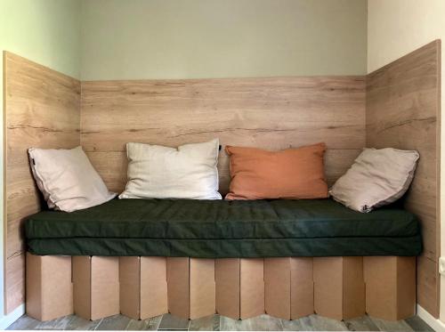 a couch with three pillows on top of it at Bungalow 314 in Joachimsthal