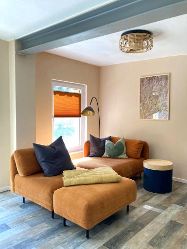 a living room with two couches and a couch at Bungalow 314 in Joachimsthal