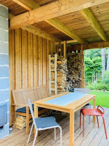 a wooden table and chairs on a wooden deck at Bungalow 314 in Joachimsthal