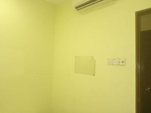 a white room with a box on the wall at RAS Hotel in Kuala Lumpur