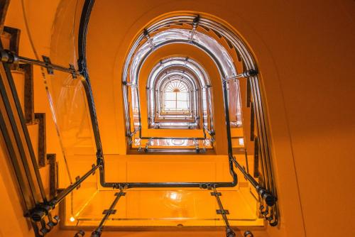 an orange room with a window in a building at Martina al Colosseo in Rome