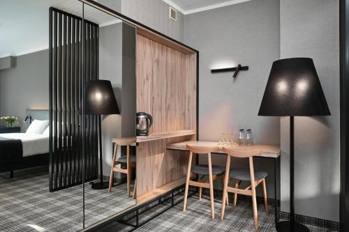 Postel nebo postele na pokoji v ubytování Hotel Halo Szczyrk