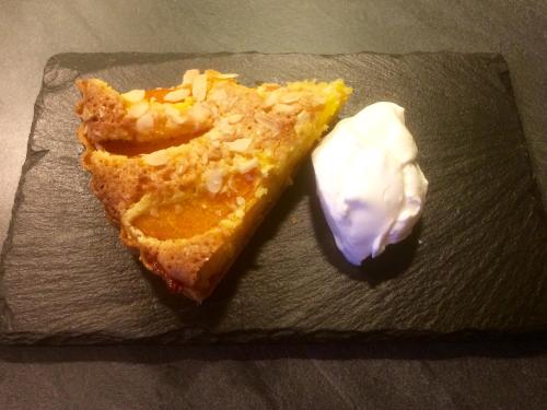 a piece of pie and a dollop of sour cream at La Crepelliere in Villedieu-les-Poëles