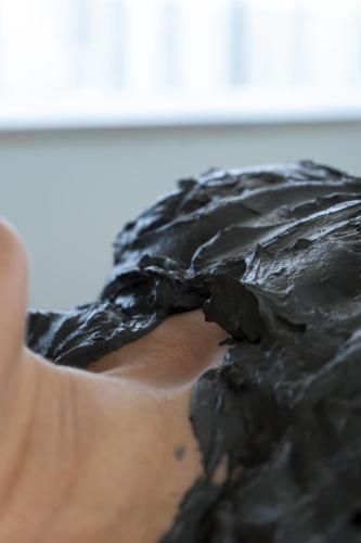 a person is covered with black plastic on their face at Hotel Terme Leonardo in Abano Terme
