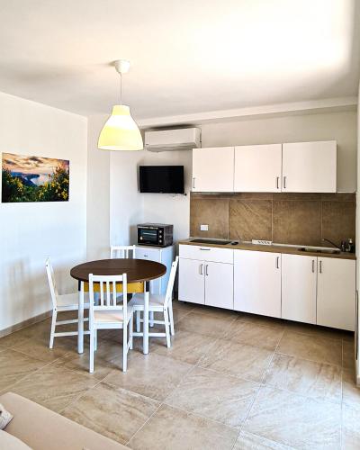 A kitchen or kitchenette at Rediesis Apartments