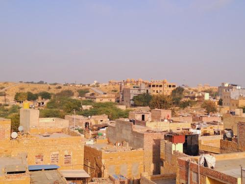 a view of a city with houses and buildings at Bob Cafe & Guest House Jaisalmer in Jaisalmer