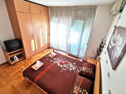 Postel nebo postele na pokoji v ubytování Mira Apartment