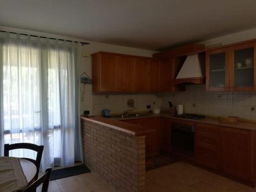 A kitchen or kitchenette at Sa domu mia