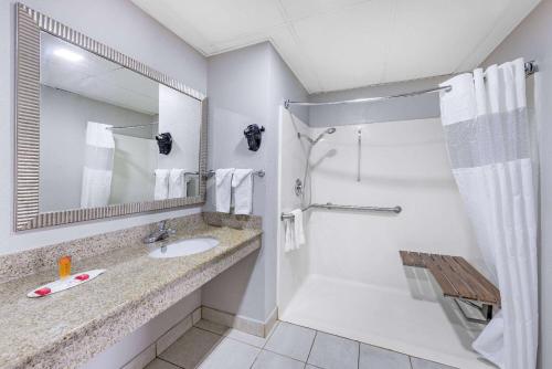 a bathroom with a sink and a shower at Days Inn by Wyndham Fredericksburg North in Fredericksburg