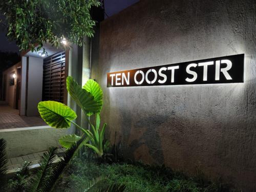 a sign on a wall that reads ten lost stir at East Park Inn in Polokwane