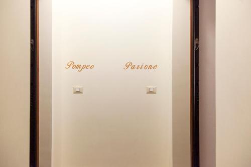 a door with the words gamma tomato tomato and gamma gamma at Palazzetto de Lante Appartamento Parione in Rome