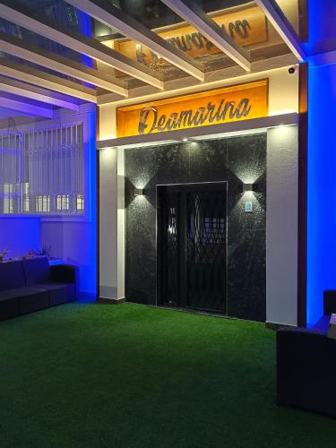 a room with a door with a sign that reads dopamine at Residence Deamarina in Marina di Massa