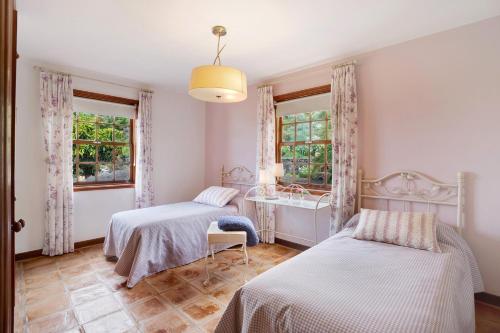 Ένα ή περισσότερα κρεβάτια σε δωμάτιο στο Casa 1700 Los Quemados