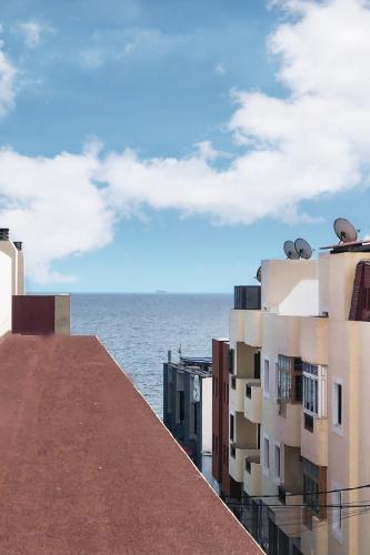 a view of the ocean from the roof of a building at Fuerteventura Beach Vacations and Blue Mango surf&fitness center at charco in Puerto del Rosario