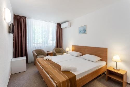 Postel nebo postele na pokoji v ubytování Hotel Neko