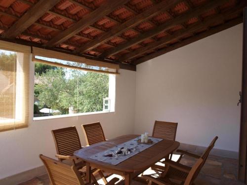 a dining room with a wooden table and chairs at Holiday home in Milna with terrace, air conditioning, WiFi, washing machine 5123-1 in Milna