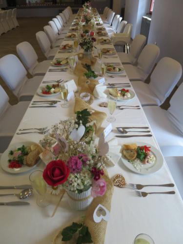 a long table with plates of food on it at HolidayPark Mlázovy in Kolinec