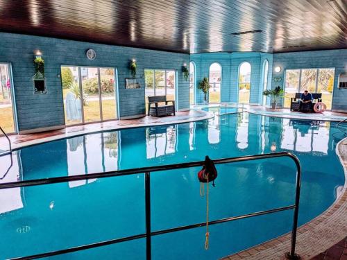 a swimming pool in a building with a pool at No.7 Perran View in St. Agnes 