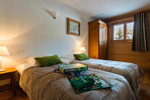 Ліжко або ліжка в номері Lagrange Vacances Le Village des Lapons